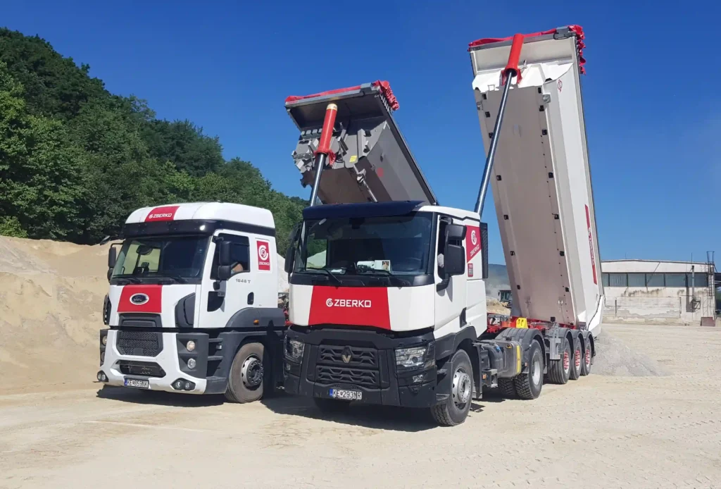 Nákladná cestná preprava. Nákladné vozidlá, vlaková doprava. Materiál preprava